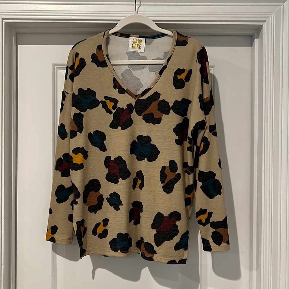 Light brown with colorful print. Boutique.